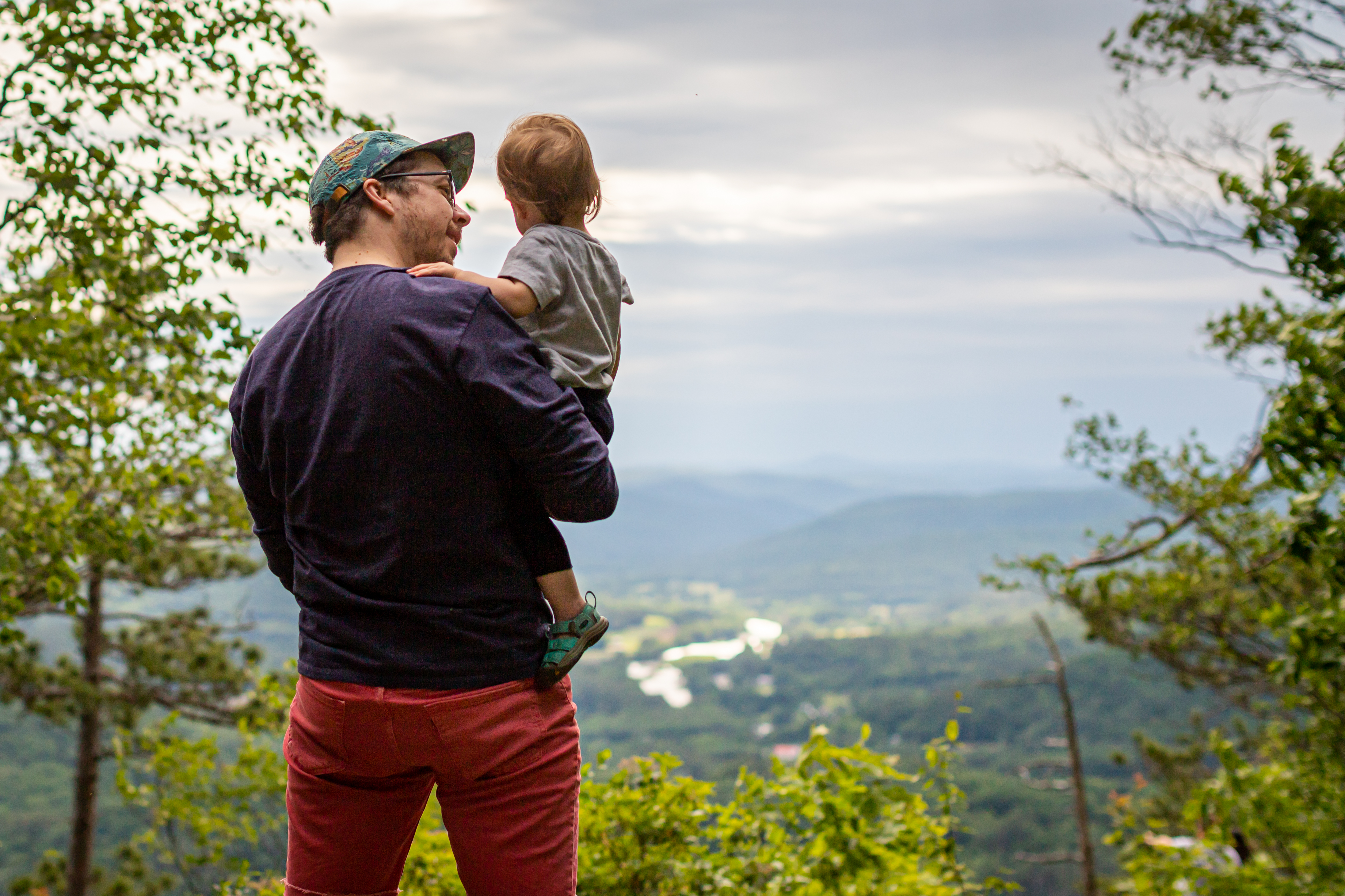 Man holding child in nature