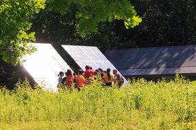 Group in front of a ground-mounted solar array at Pleasant Valley