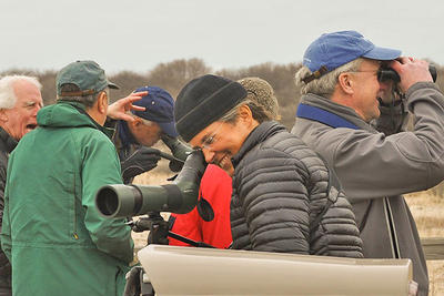 Leadership Friend looking through spotting scope