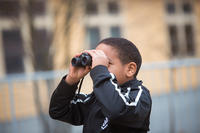 Young boy with binoculars