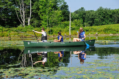 Teen girls canoeing at Wachusett Meadow Wildlife Sanctuary