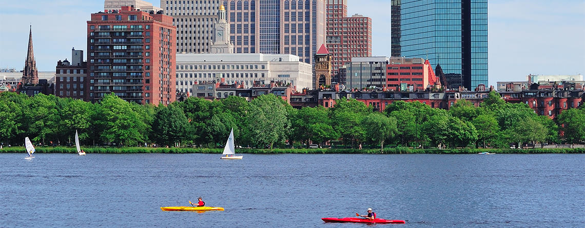 Boston skyline & Charles River kayakers in summer