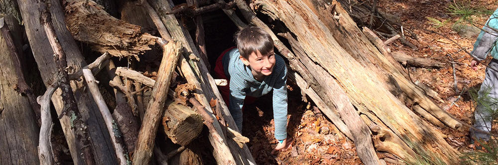 Boy exploring Nature Play Area at Moose Hill 750