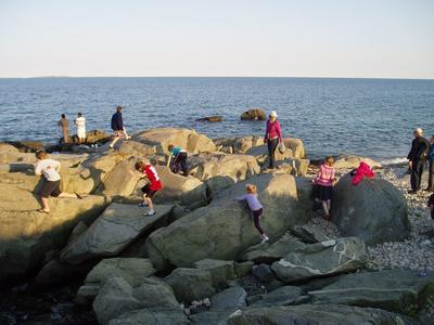 people playing on the rocks
