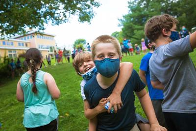 Campers playing outdoors at Boston Nature Center Camp