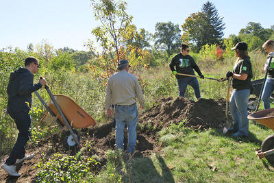 TD Volunteers Planting Trees at the BNC
