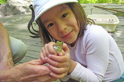 Holding a frog during April Vacation Week