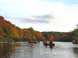 Canoeing on the Charles River in autumn
