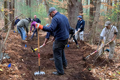 Volunteers working to build a trail at Broadmoor Wildlife Sanctuary