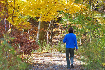 Walking a trail at Broadmoor in fall