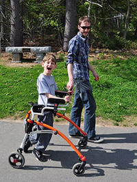 Child with walker on accessible path
