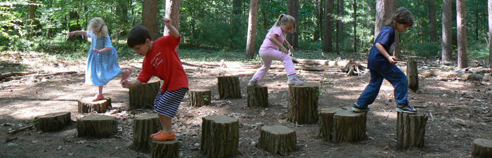 Kids playing on the stump jump at Drumlin Farm Wildlife Sanctuary