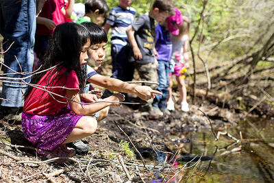 Two Drumlin preschoolers examining a stream