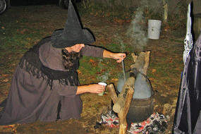 Witch brewing hot drinks at Tales of the Night