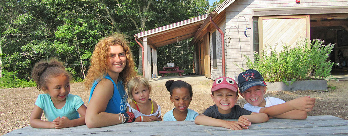 Felix Neck campers smiling in front of the Barn