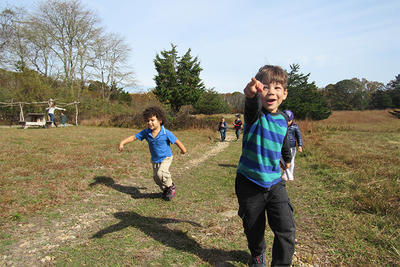 FN preschoolers running in field