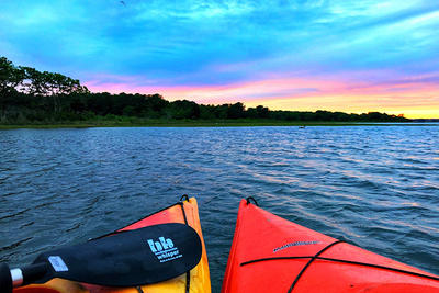 Sunset view from kayaks at Felix Neck Wildlife Sanctuary in summer