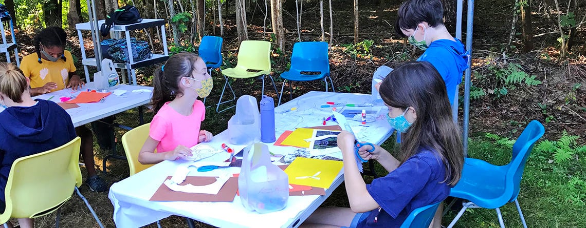 MABA 2020 campers in face masks creating art outside