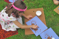 Girl doing outdoor nature craft in summer at Moose Hill