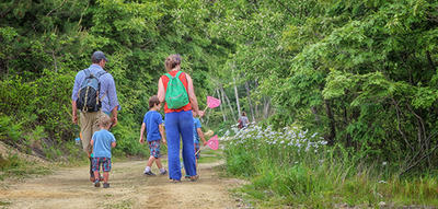 Family on a trail in summer at Tidmarsh Wildlife Sanctuary © Jeanne Lesperance