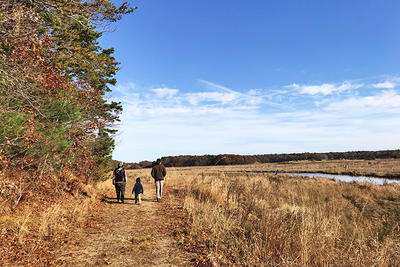 Family walking at Tidmarsh in fall