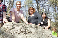 Group of teachers on a glacial boulder