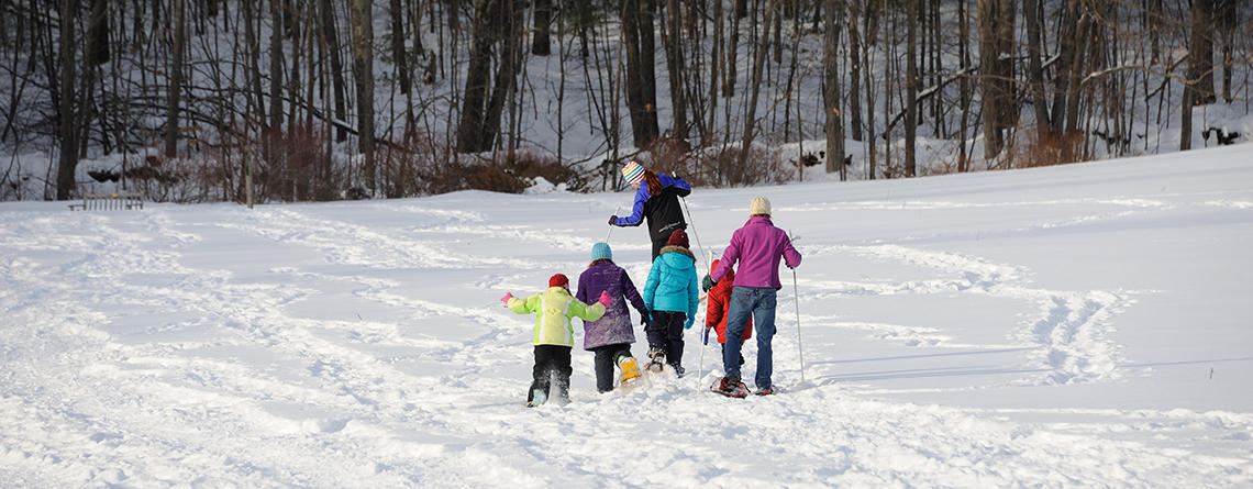 Group of kids & adults snowshoeing at Wachusett Meadow Wildlife Sanctuary © Gail Hansche Godin