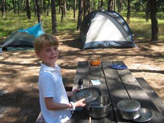 Child at a Wellfleet Bay Willdlife Sanctuary campsite