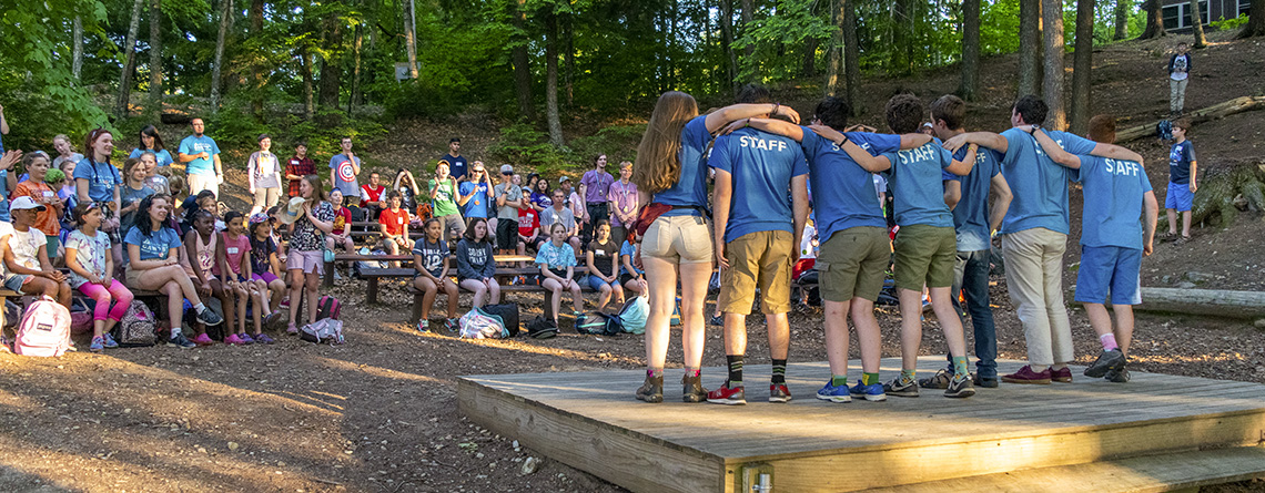Wildwood campers gather in the amphitheater for an evening program of song and dance