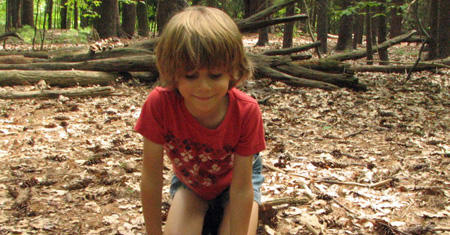 Camper looking at nature in the forest