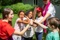 Arcadia campers holding a Wild Turkey feather