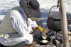 Cooking pancakes over a fire