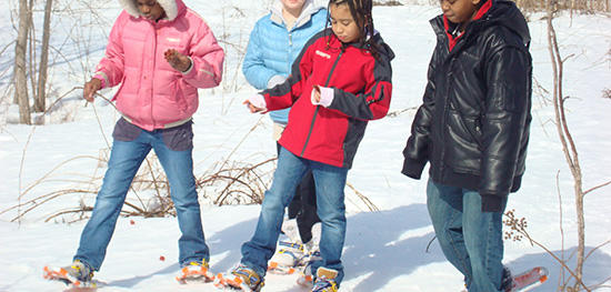 Kids snowshoeing at the BNC