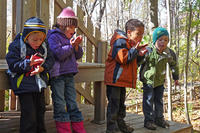 BMB preschoolers blowing milkweed fluff in fall