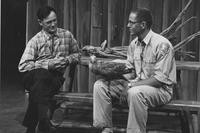 A Felix Neck naturalist with a live hawk during a 1940's TV interview