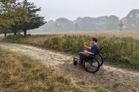 Visitor using a Freedom Chair at Felix Neck