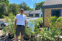Sanctuary Director Ian Ives next to the new walkway that will lead to the Discovery Center