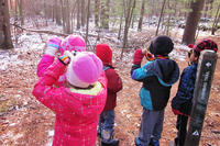 Kids using cardboard tube binoculars during Decmeber Vacation Days at Moose Hill