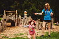 Moose Hill camper and counselor at the Nature Play Area, playing with bubbles