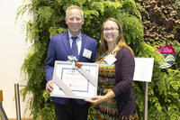 Conservation Teacher of the Year 2022, Jocelyn Chin, standing with David O'Neill, President of Mass Audubon