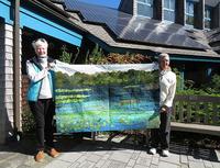 Tricia Smith (left) & wife Fran Lussier won a wall quilt sewn by Susan Goldstein