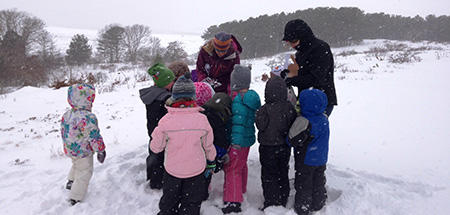 Kids in the snow at Wellfleet Bay.
