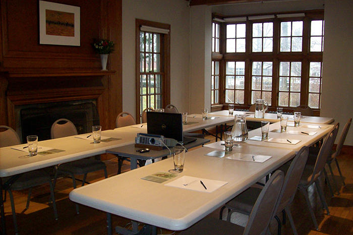 Living Room With Conference Table Set Up For 12