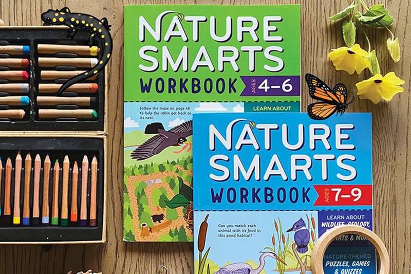 Two Nature Smarts Workbooks stacked on a table