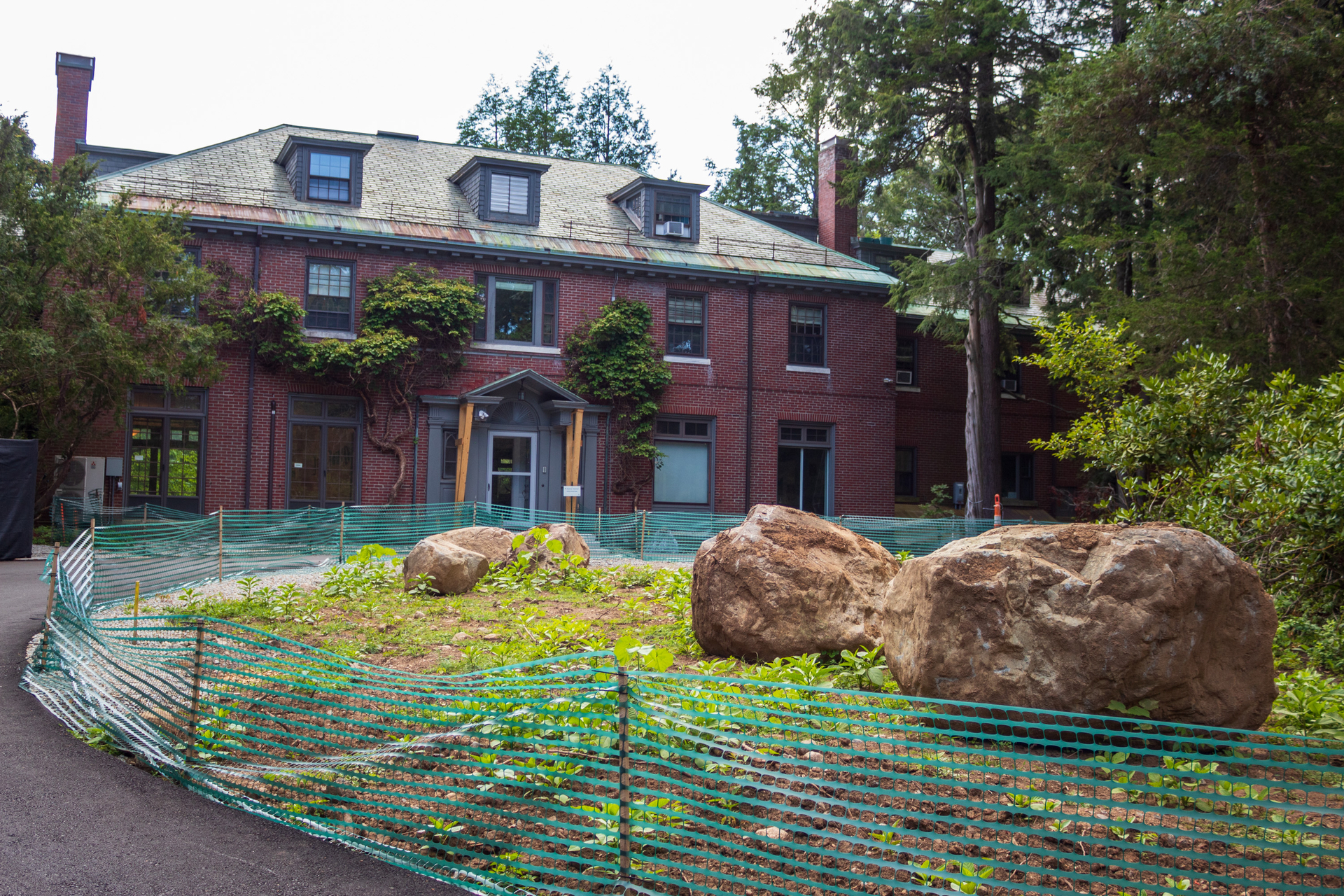 Habitat's entry circle during construction with temporary fencing