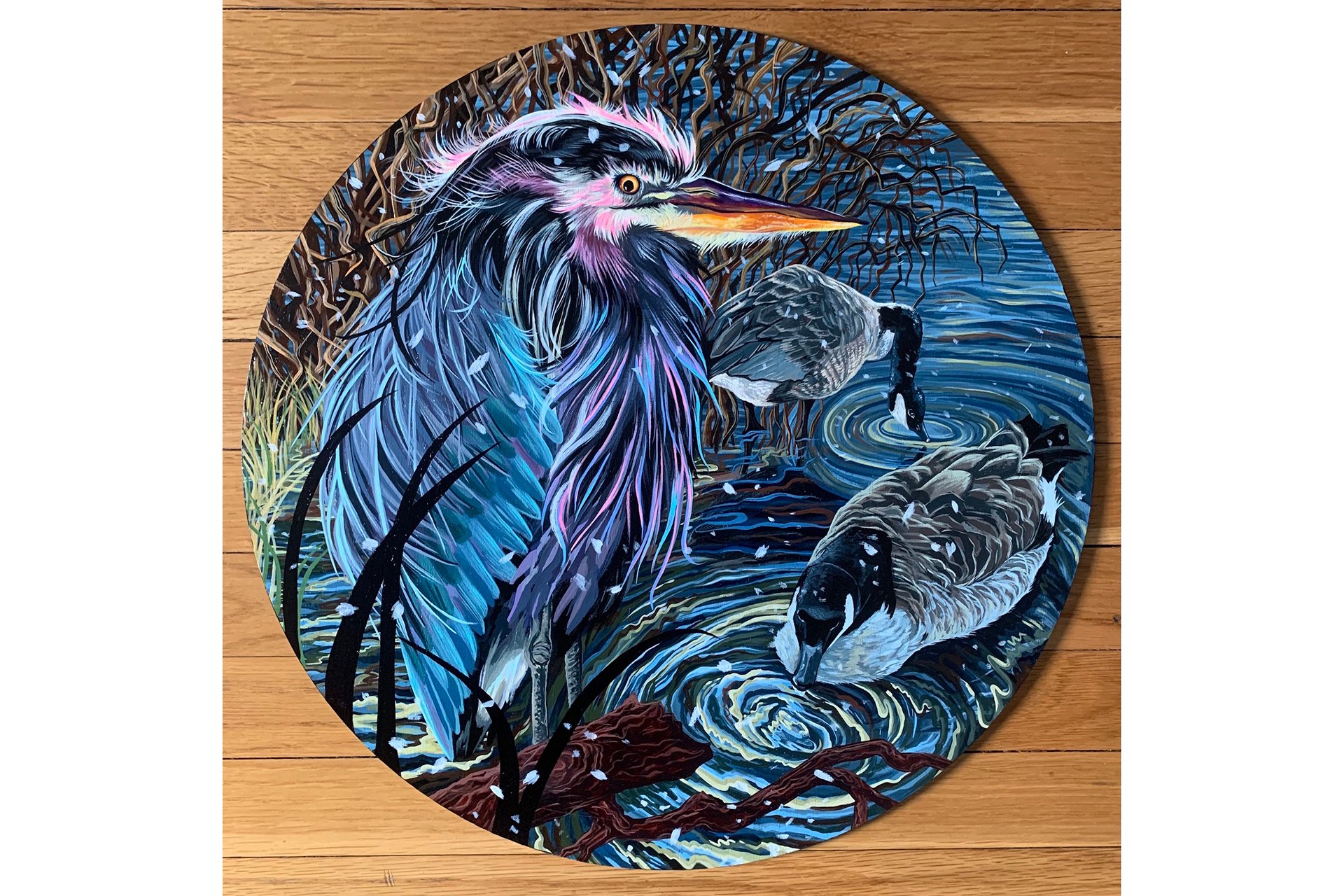 Blue-hued painting on round canvas of a heron and two ducks