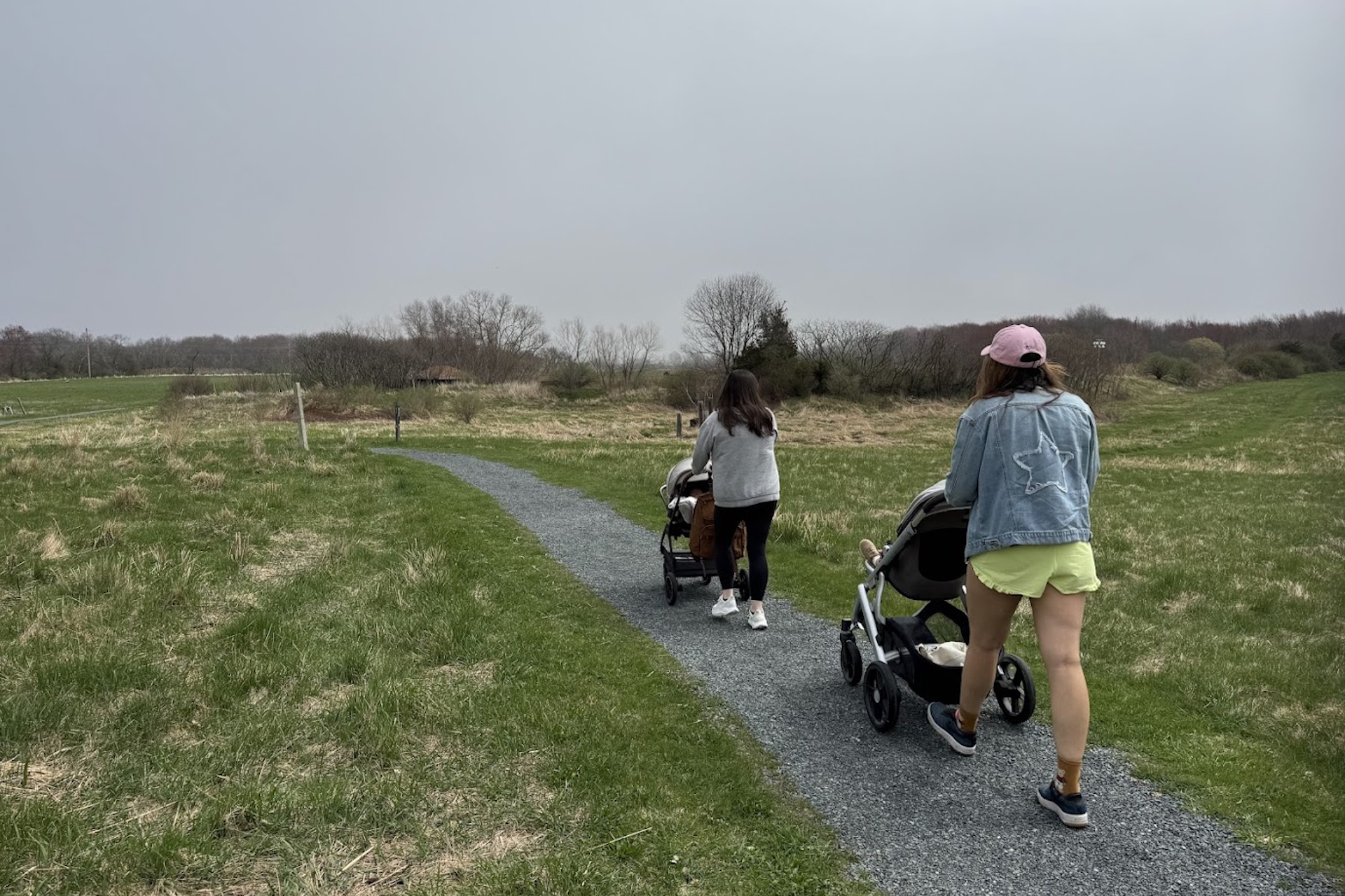 Two people with strollers on the all persons trail