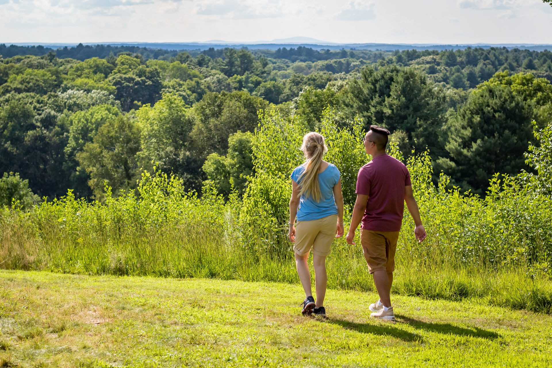 two people walking with view from top of the drumlin