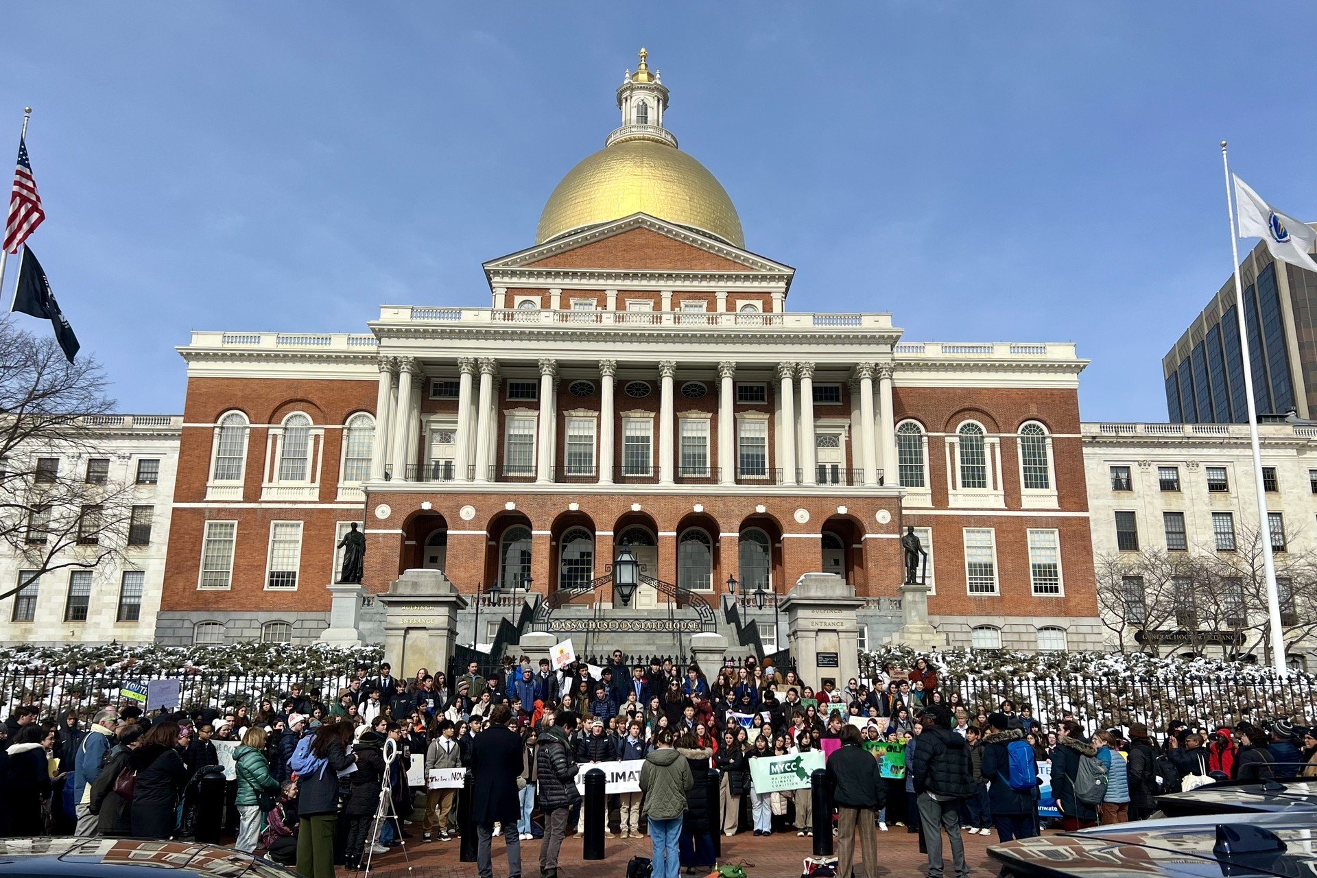 Group of people in front of Boston statehouse