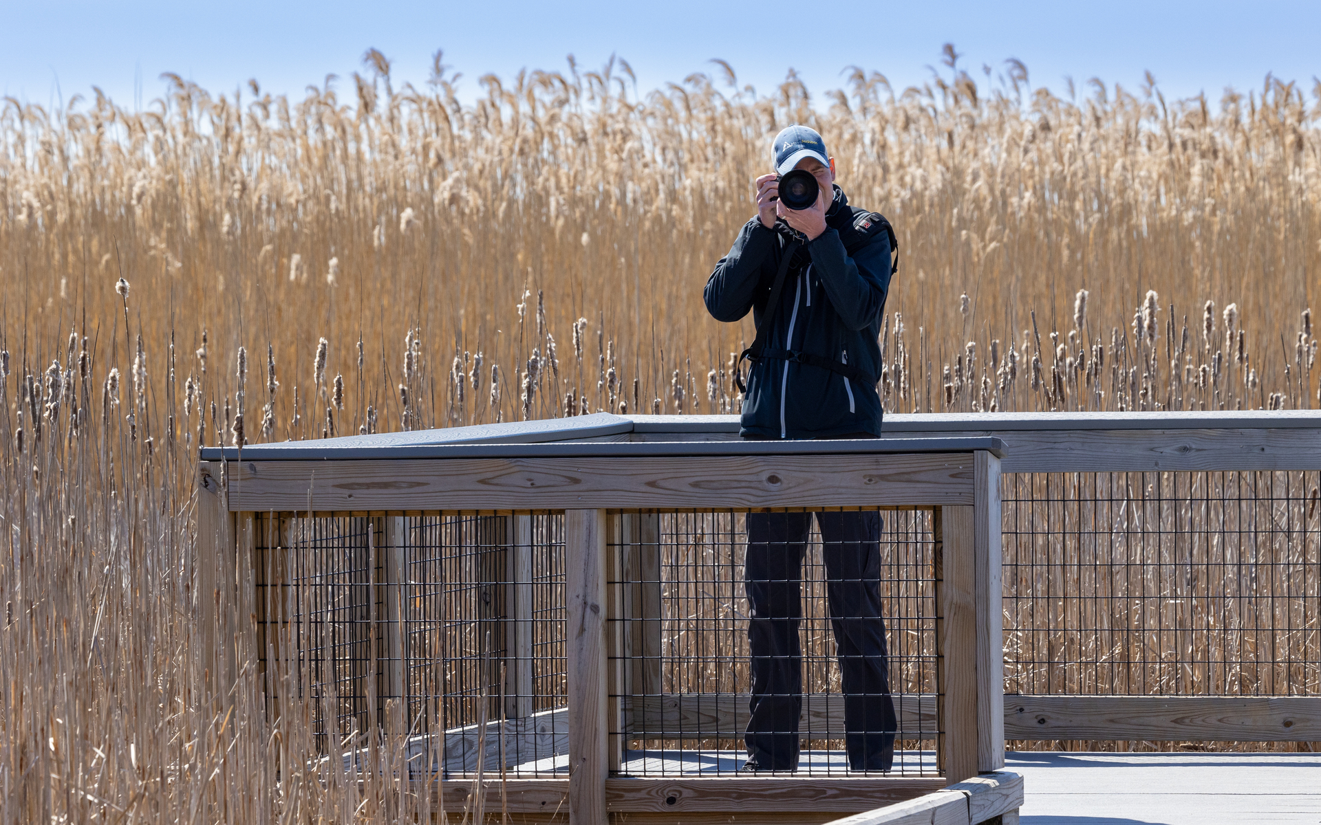 photographer facing camera lens at the camera